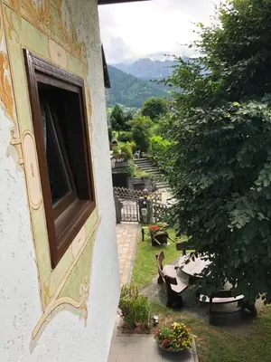 a window on the side of a building with a garden at Villa Tisot in Siror