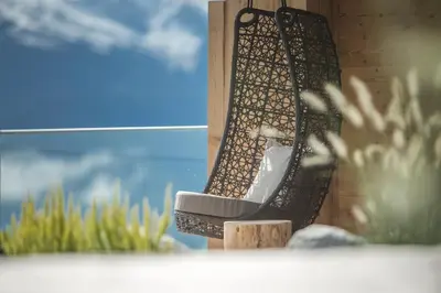 a pair of shoes hanging from the side of a building at Hotel Schönblick in Maranza