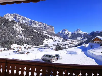 a car parked in the snow on a mountain at Garni Martlhof in Selva di Val Gardena