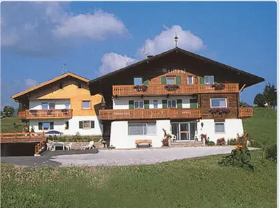 a large building with a cross on top of it at Garni Martlhof in Selva di Val Gardena