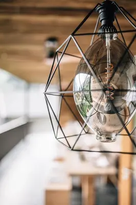 a light bulb hanging from a ceiling at Hotel Wildschütz in San Leonardo in Passiria