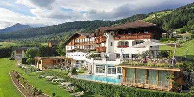 a large building with a pool in front of it at Hotel Schönblick in Rodengo