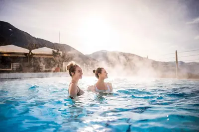 two women in the water in a hot tub at Hotel Schönblick in Rodengo