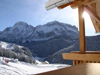 a view of a snow covered mountain from a ski lodge at Apartments Rit in La Valle