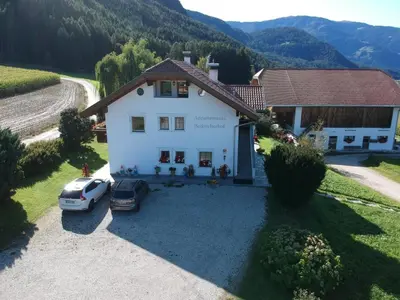 an aerial view of a house with a car parked in the driveway at Beikircherhof in San Lorenzo di Sebato