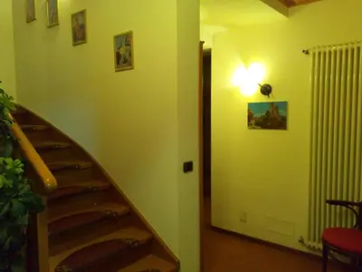 a dining room with tables and chairs in a room at B&B Casa Bazzanella in Cavalese