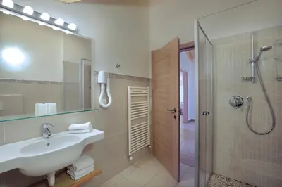 a bathroom with a sink and a shower at Villa Prafiorì in Cavalese