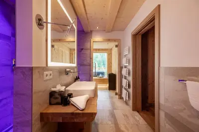 a bathroom with a sink and a mirror at Mountain Village Hasenegg in Schenna