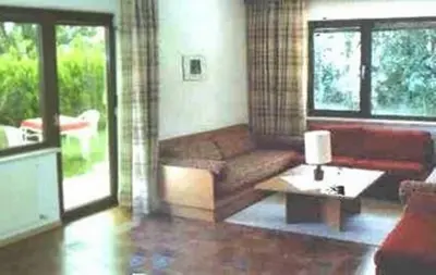 a living room with a couch and a coffee table at Appartements Oberpefohl in Parcines