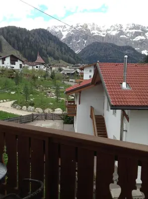 a balcony of a house with a view of a mountain at Villa Seceda in Selva di Val Gardena