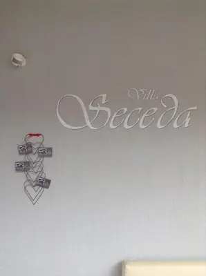 a sign on the wall of a room at Villa Seceda in Selva di Val Gardena