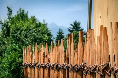 a wooden fence with a rope on it at Hörmannhof in Bressanone