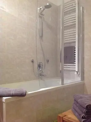 a bathroom with a shower with a bath tub at HOME DI CRISTINA in Laives