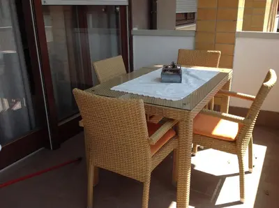 a dining room table with chairs and a box on it at HOME DI CRISTINA in Laives