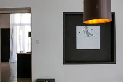 a room with a picture of a skier on the wall at Apartment Andreas in Bolzano