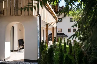 an external view of a building with a courtyard at Chalet Dolomit in San Lorenzo di Sebato