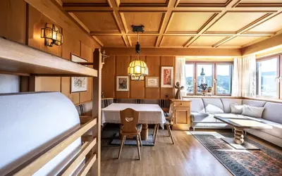 a living room with a table and a couch at Apartments Sayonara in Castelrotto
