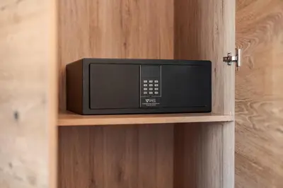 a microwave on a shelf in a room at Albergo Belvedere in Vigo di Fassa