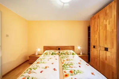 a bedroom with a large bed in a room at Oberkapillhof in Meltina