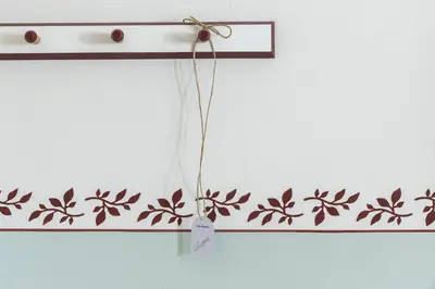 a price tag on a wall with a flower pattern at Villa Gloria in Soprabolzano
