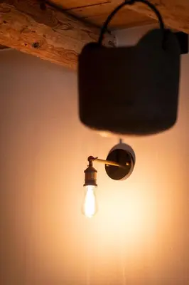a light bulb hanging from a ceiling at Appartamenti La Rocia in Rocca Pietore