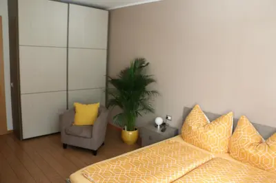 a living room with a couch and a chair at Appartment Larcher - Meinhard in Merano