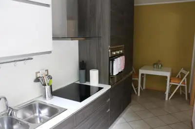 a kitchen with a sink and a counter top at Appartment Larcher - Meinhard in Merano