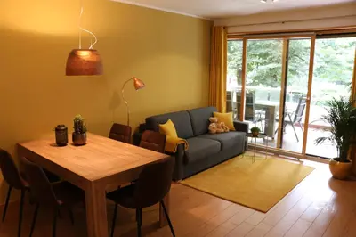 a living room with a table and a couch at Appartment Larcher - Meinhard in Merano
