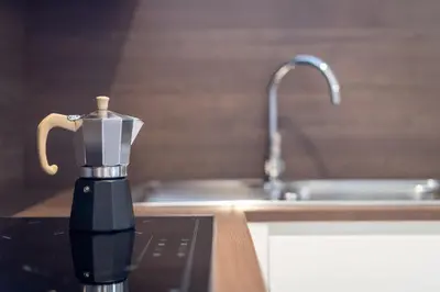 a blender sitting on a kitchen counter next to a sink at Glögglhof in Appiano sulla Strada del Vino