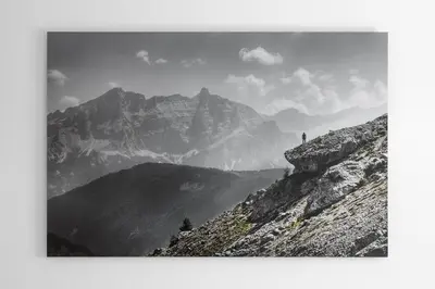 a person standing on the top of a mountain at ARTEFUGIUM panoramico in Selva di Val Gardena