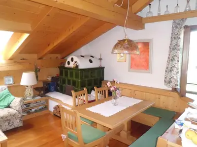 a dining room with a table and chairs in a room at Casa Venturini in Moena