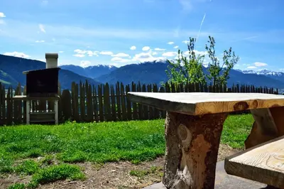 a kitchen with a table with a red table cloth at Traterhof-Spinges in Mühlbach