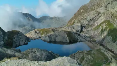 a lake in the middle of a mountain at Oberangerhof in Lagundo