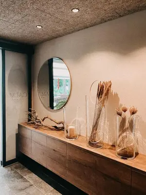 a counter with vases on it with a mirror at Apparthotel Calma in Cermes