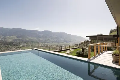 a swimming pool with a view of a mountain at Residence Aqualis in Marlengo