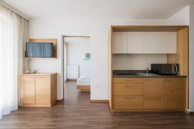 a kitchen with a sink and a microwave at Residence Aqualis in Marlengo