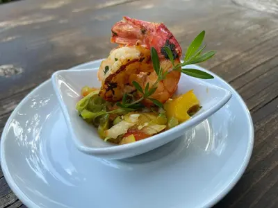 a bowl of food on a plate on a table at Hotel Sonnenhof in Lana