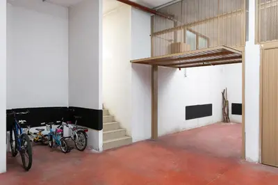 a group of bikes parked in a building at Kristiania in Campitello