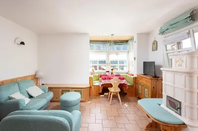 a living room with a couch and a table at Kristiania in Campitello