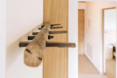 a cat climbing up the side of a wall at Baumgartnerhof BLAUBURGUNDER in Cortaccia
