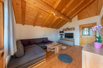a living room with a couch and a table at Ferienwohnungen Oberweier in Merano