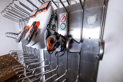 a close up of a metal appliance with tools on it at Appartamenti Bel Sit in Canazei