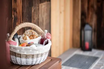 a basket filled with food on a wooden table at Kristplonerhof in Bolzano