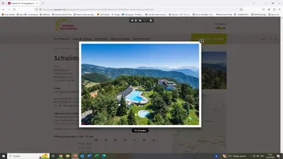 a screenshot of a website with a picture of a house at Kristplonerhof in Bolzano