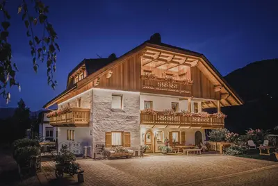 a large house with a balcony on top of it at App. Promberger in San Lorenzo di Sebato