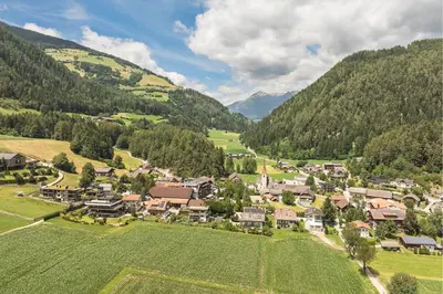 an aerial view of a small village in the mountains at App. Promberger in San Lorenzo di Sebato