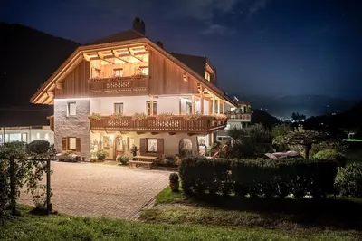 a large house with a balcony on top of it at App. Promberger in San Lorenzo di Sebato