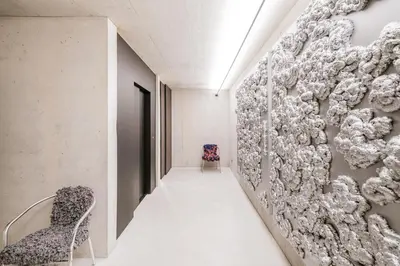 a hallway with a wall of balls at Hotel Hurtmuehle Kronblick in San Lorenzo di Sebato