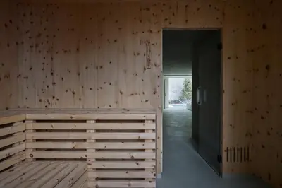 a room with a wooden wall and a doorway at Odles Lodge in Bressanone