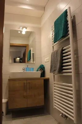 a bathroom with a sink and a mirror at Appartements Pixner in Saltusio
